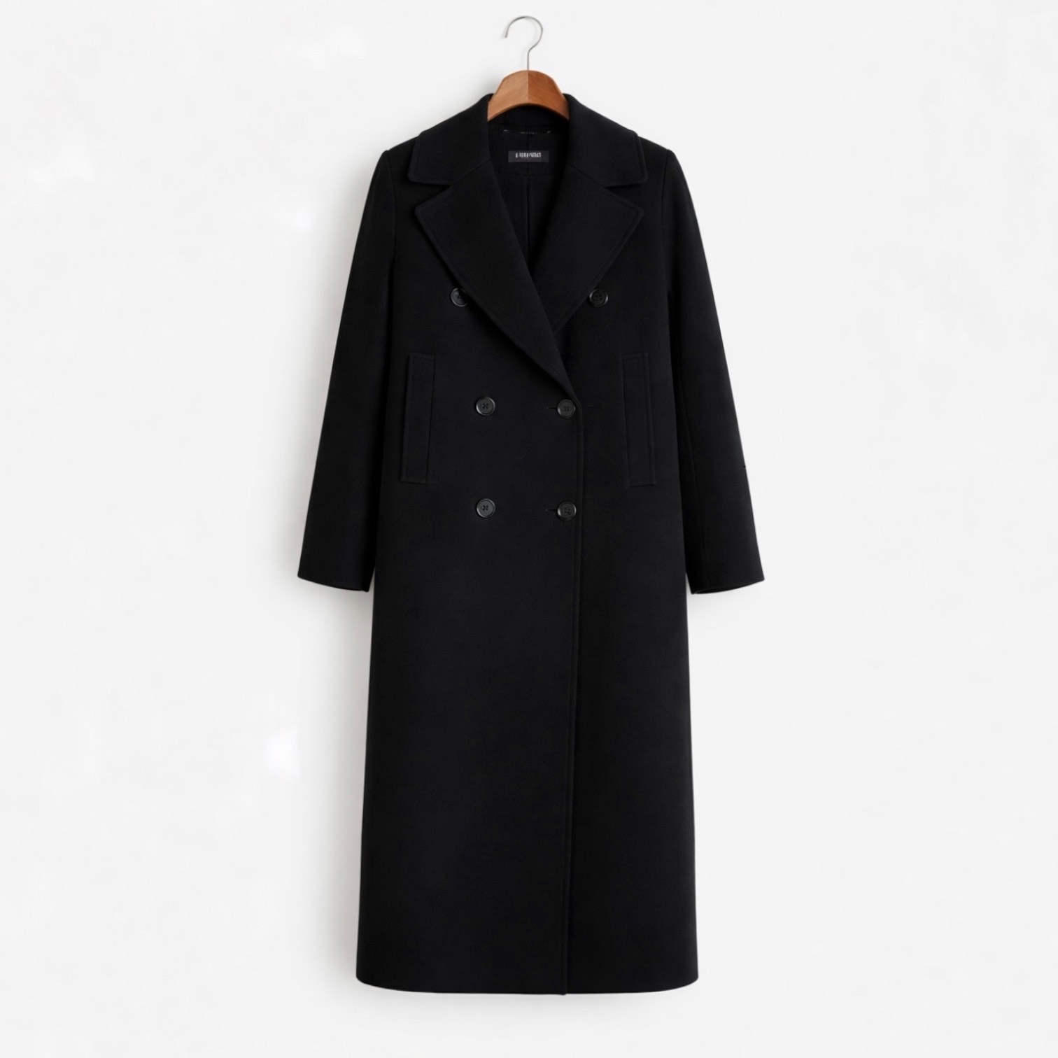 The Tailored Black Coat: Why It Anchors a Professional Wardrobe